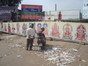 The long hoarding with deity photos